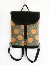 floral vegan backpack with flap closing nad antique brass metal parts made from cotton canvas