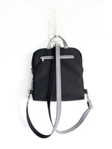 gray mickey mouse disney backpack, rounded style rucksack with zipper pocket, bohemian disney land backpack, backpack with small mickey mouse heads, convertible shoulder bag