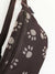 dark brown waterproof fanny pack with printed dog paws on the outside, zipper pocket on the front and adjustable strap